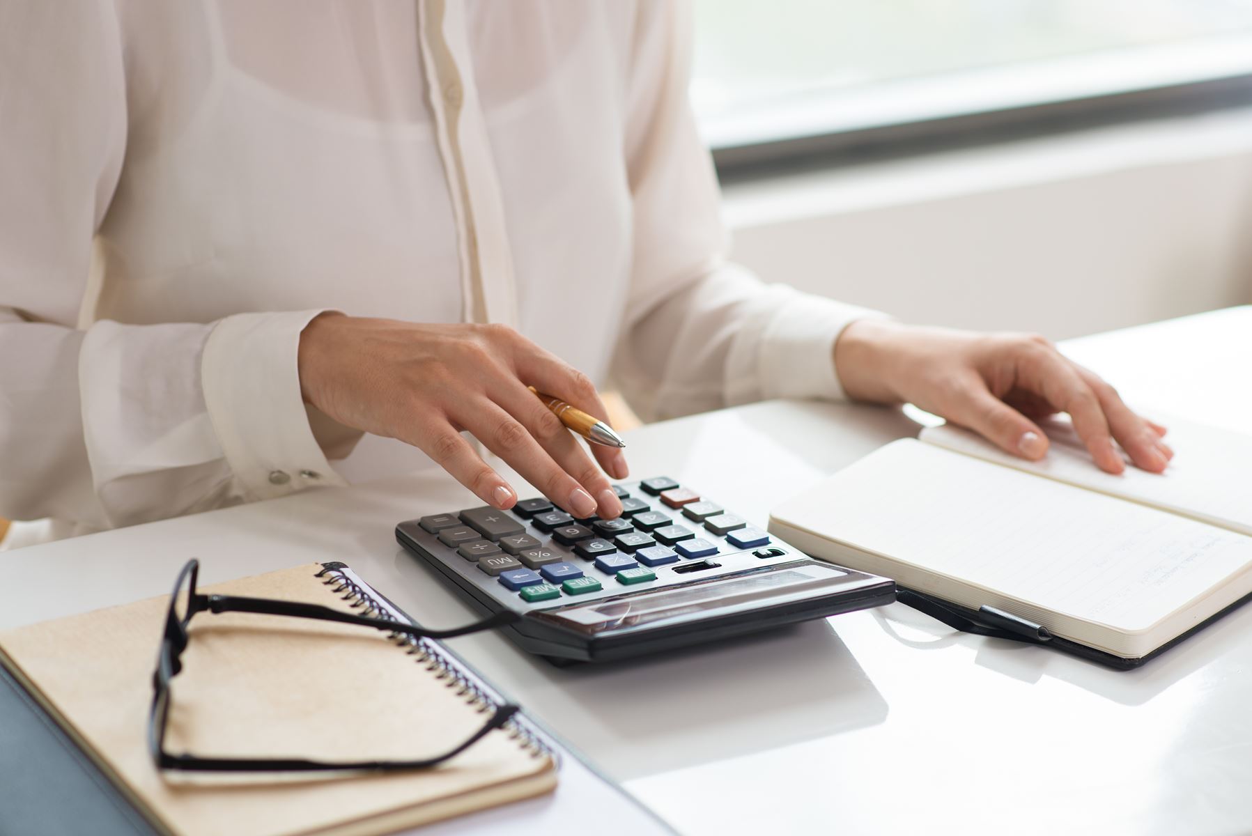 Woman using a calculator