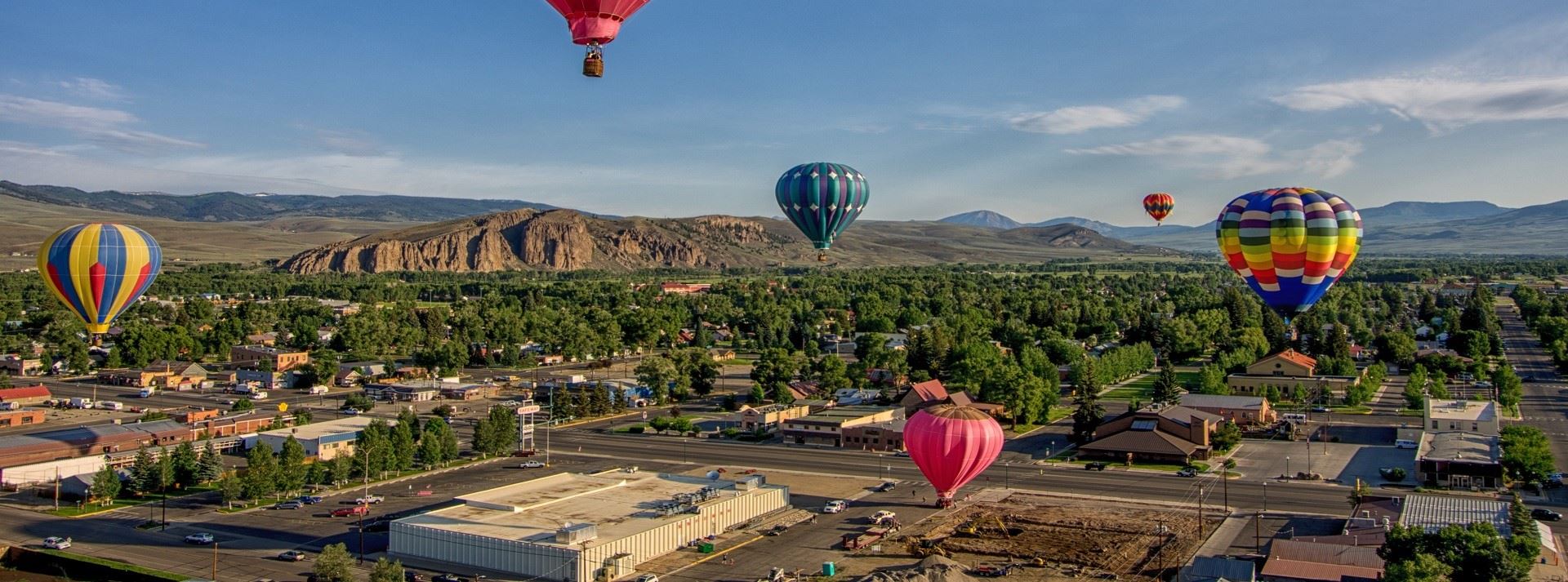 Hot air balloons above a town 