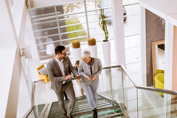 two people walking up stairs
